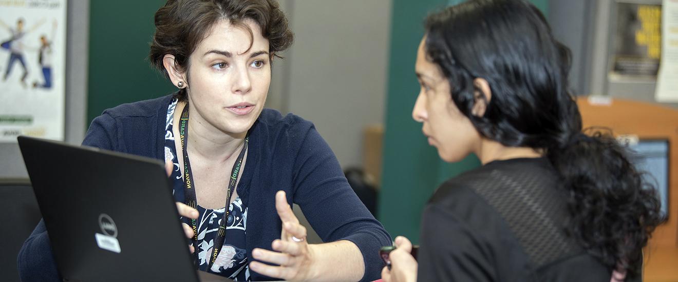 a student being helped by a staff member